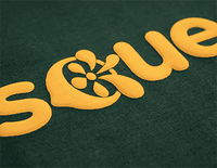 Yellow puff vinyl text with floral design on green fabric