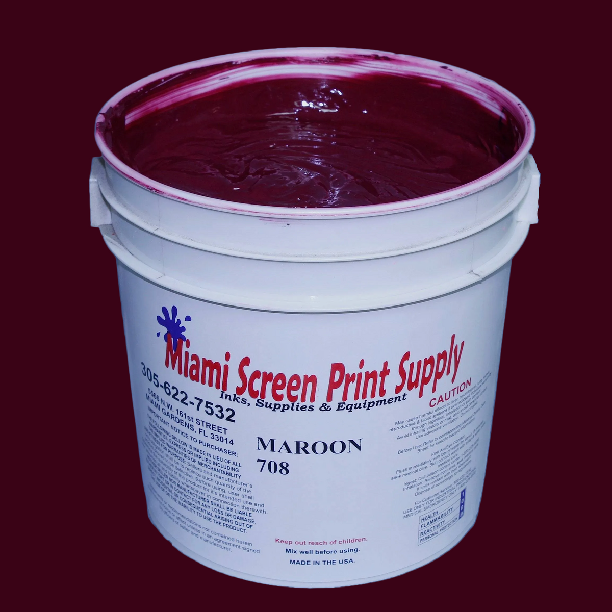 Bucket of maroon paint with 'Miami Screen Print Supply' label on a dark red background