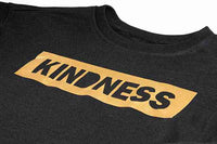 Black shirt with gold 'Kindness' design